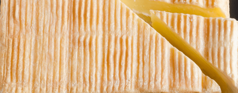 Uncooked unpressed soft cheese with a washed rind